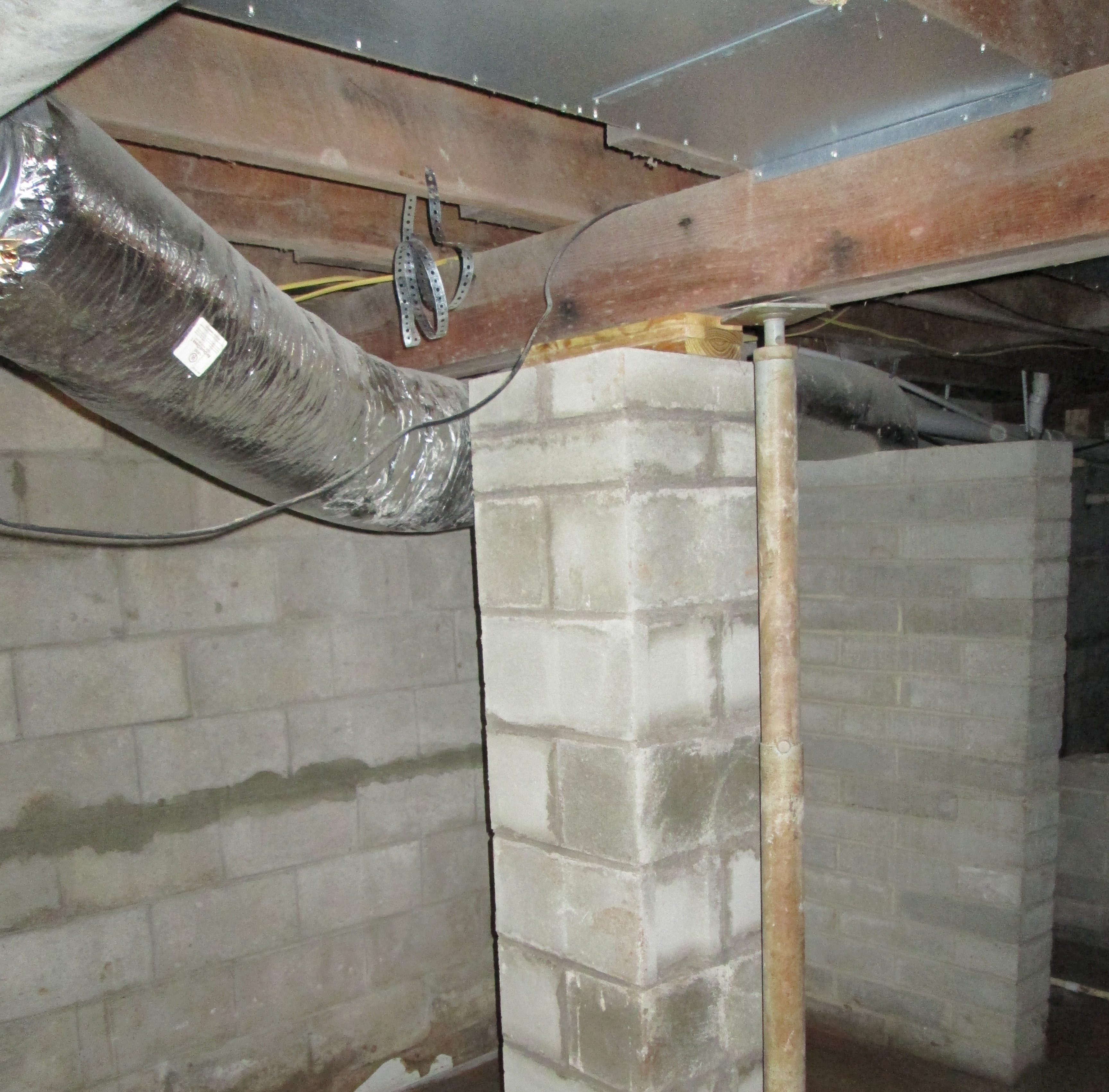 New pilaster in basement for foundation repair - Atlantic Foundation & Crawl Space