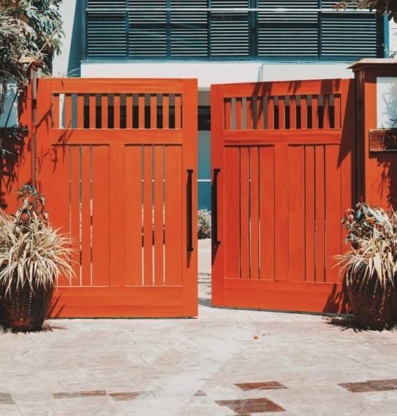 Concrete Slab Driveway with Orange Driveway Fence - Atlantic Foundation & Crawl Space