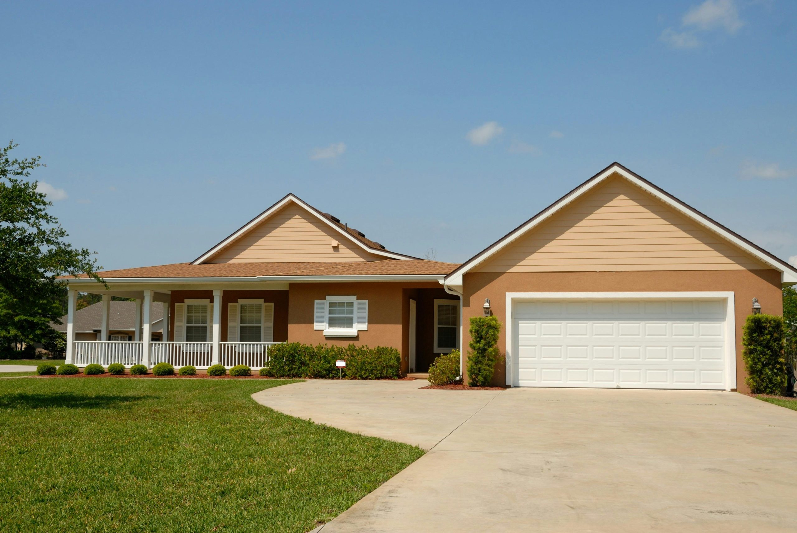 Older homes, beige in color with cement driveway - Atlantic Foundation